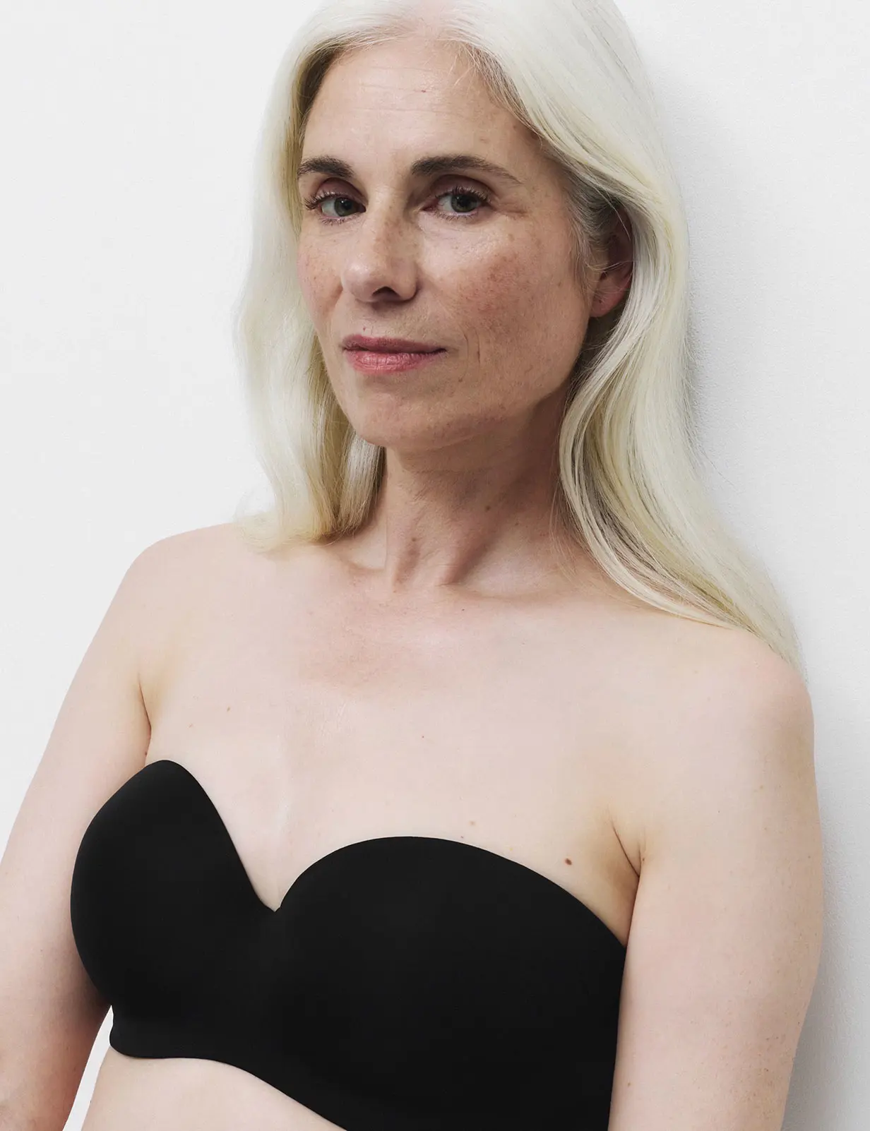 Woman wearing black strapless post-surgery bra