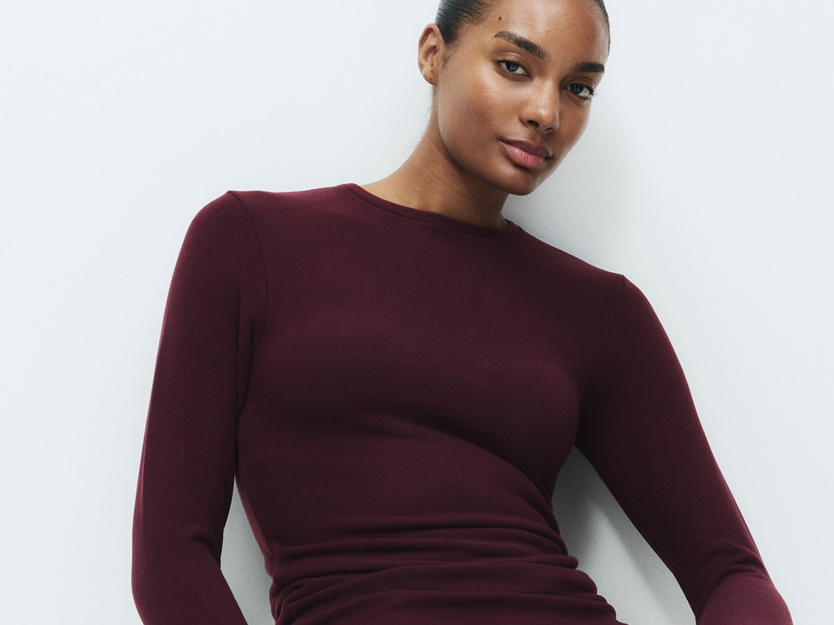 Woman wearing burgundy thermal top