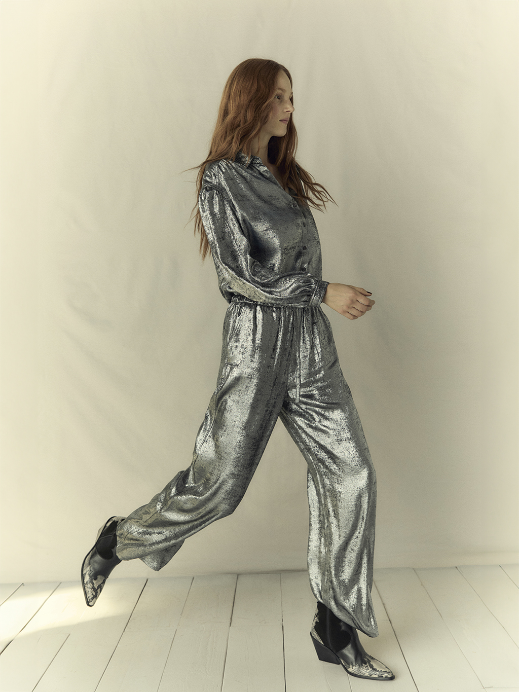 Woman wearing silver Per Una shirt and matching trousers