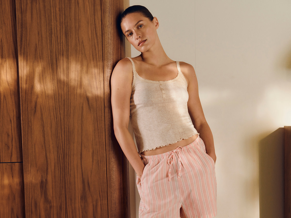 Woman wearing pink pyjamas