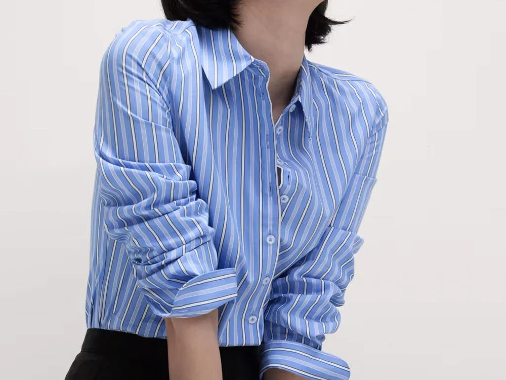 Close-up of woman wearing a blue striped shirt