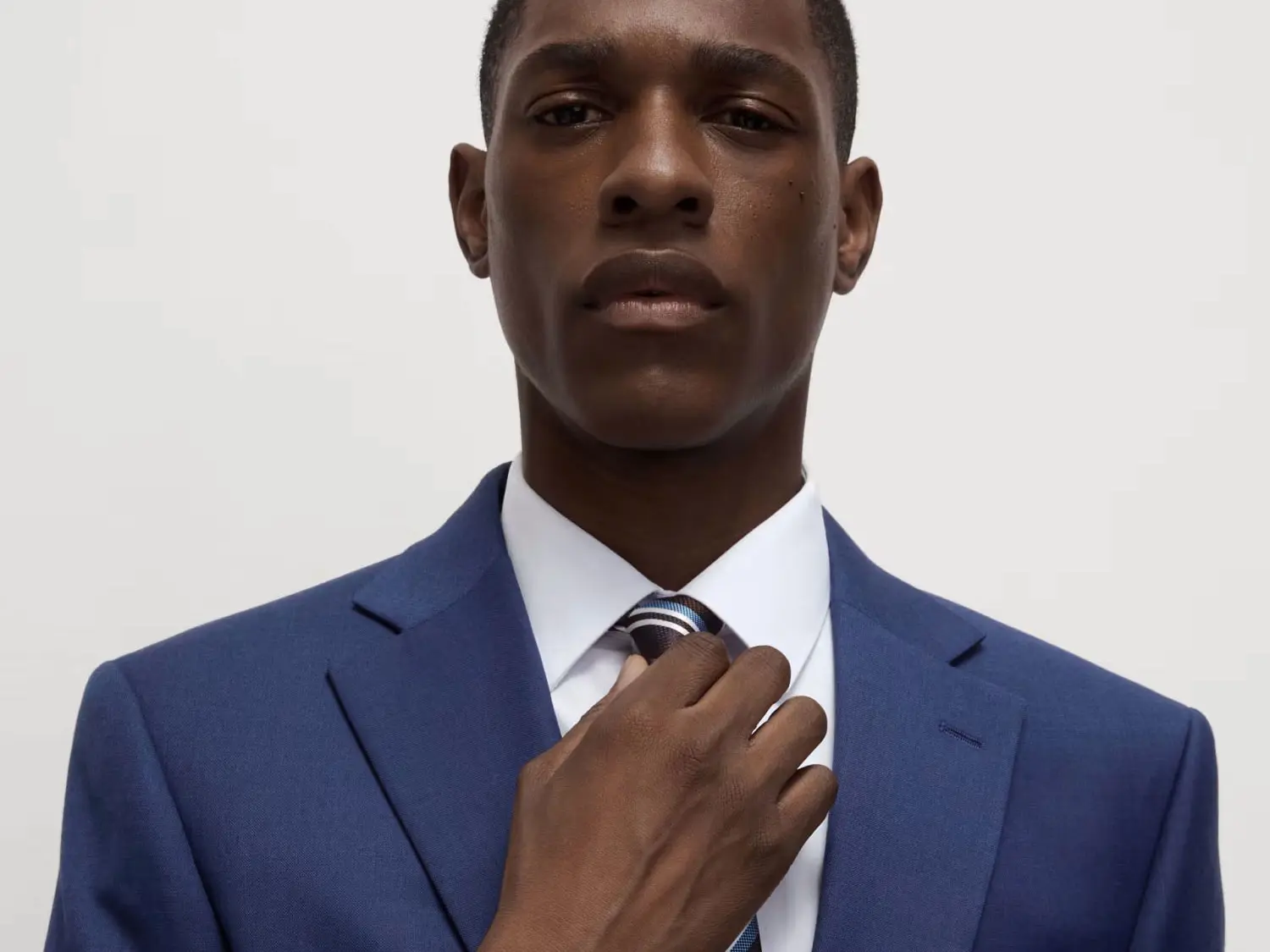 Man wearing blue suit and white shirt at M&S