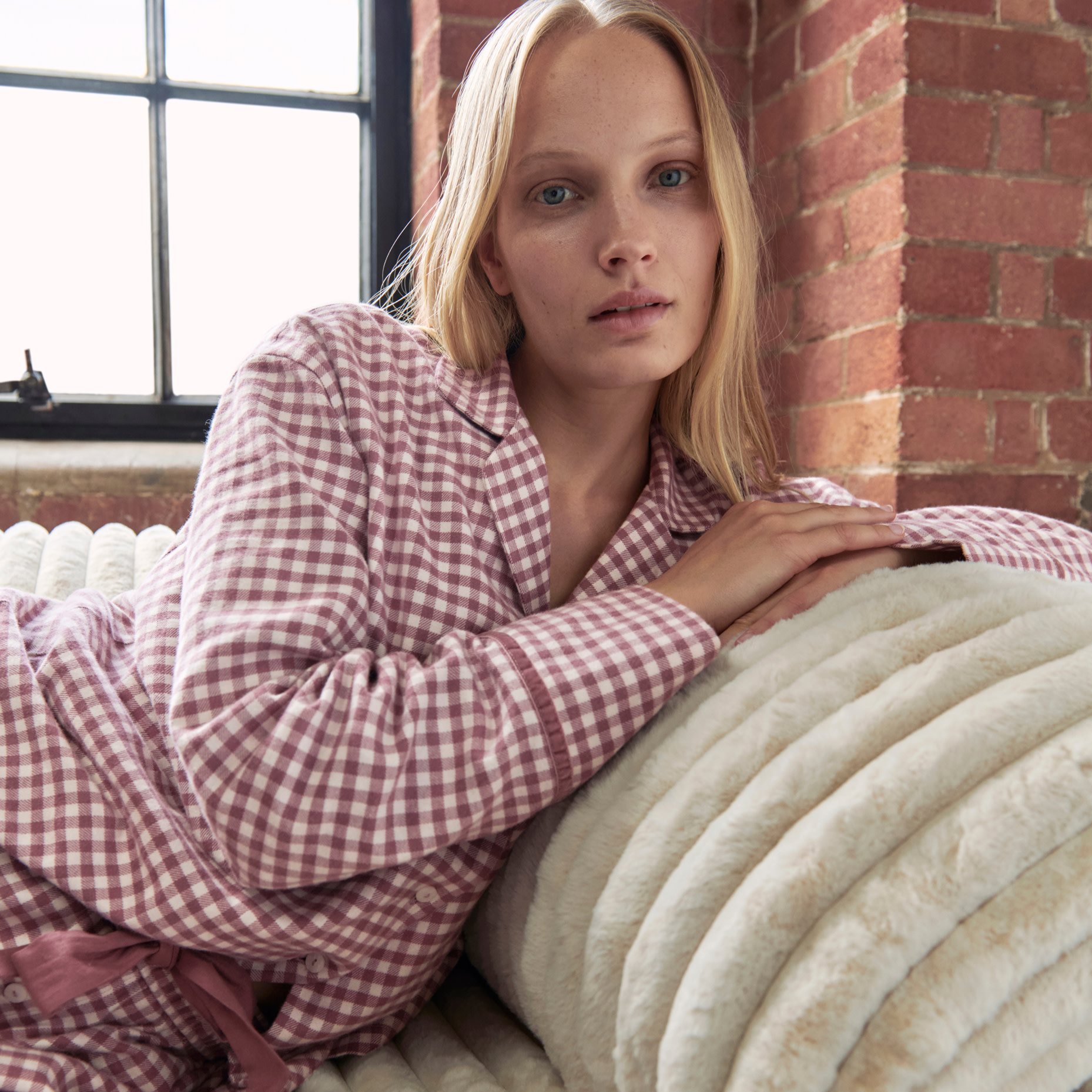 woman wearing red with white checked pyjamas