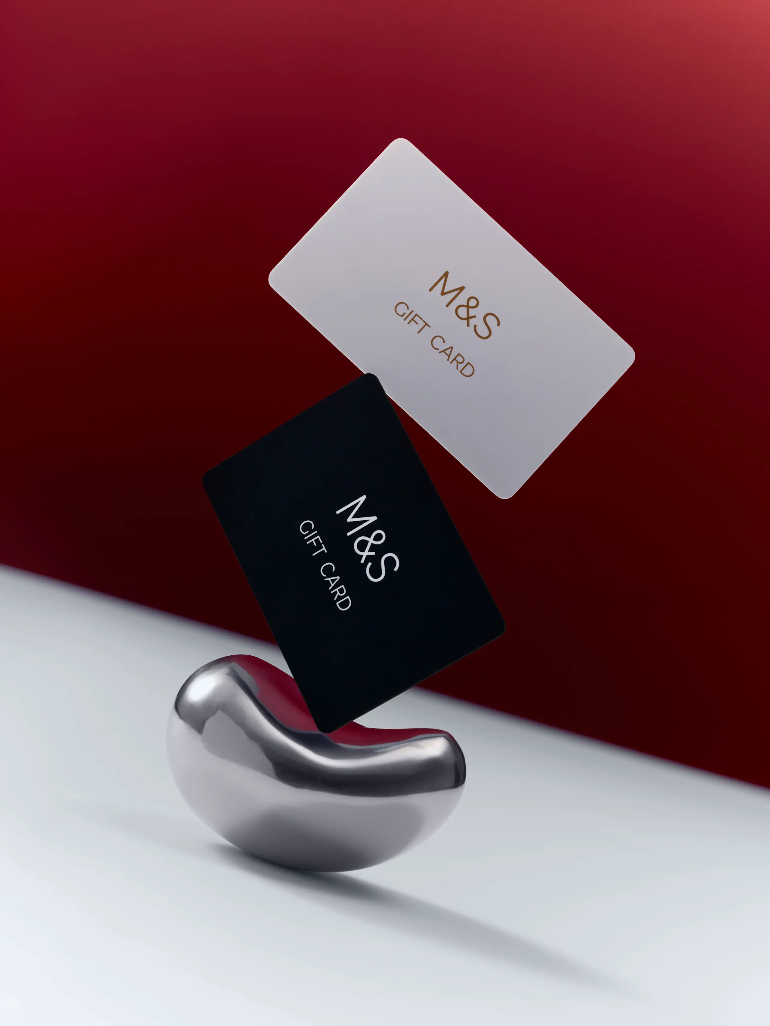 Image of two M&S gift cards in black and white