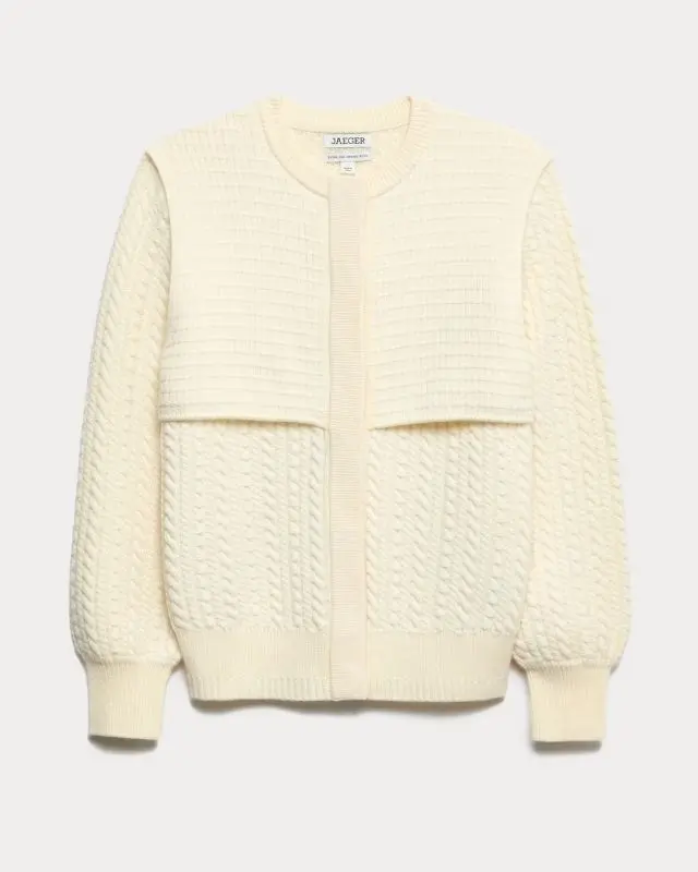 A cream cable knit Merino wool cardigan