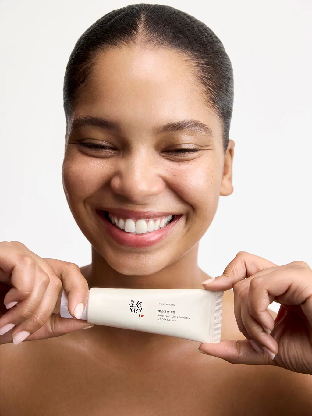 Woman holding skincare product