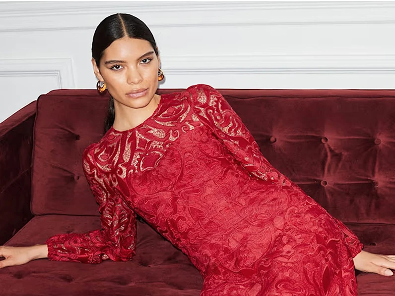 Woman wearing red lace dress to celebrate Lunar New Year 2026
