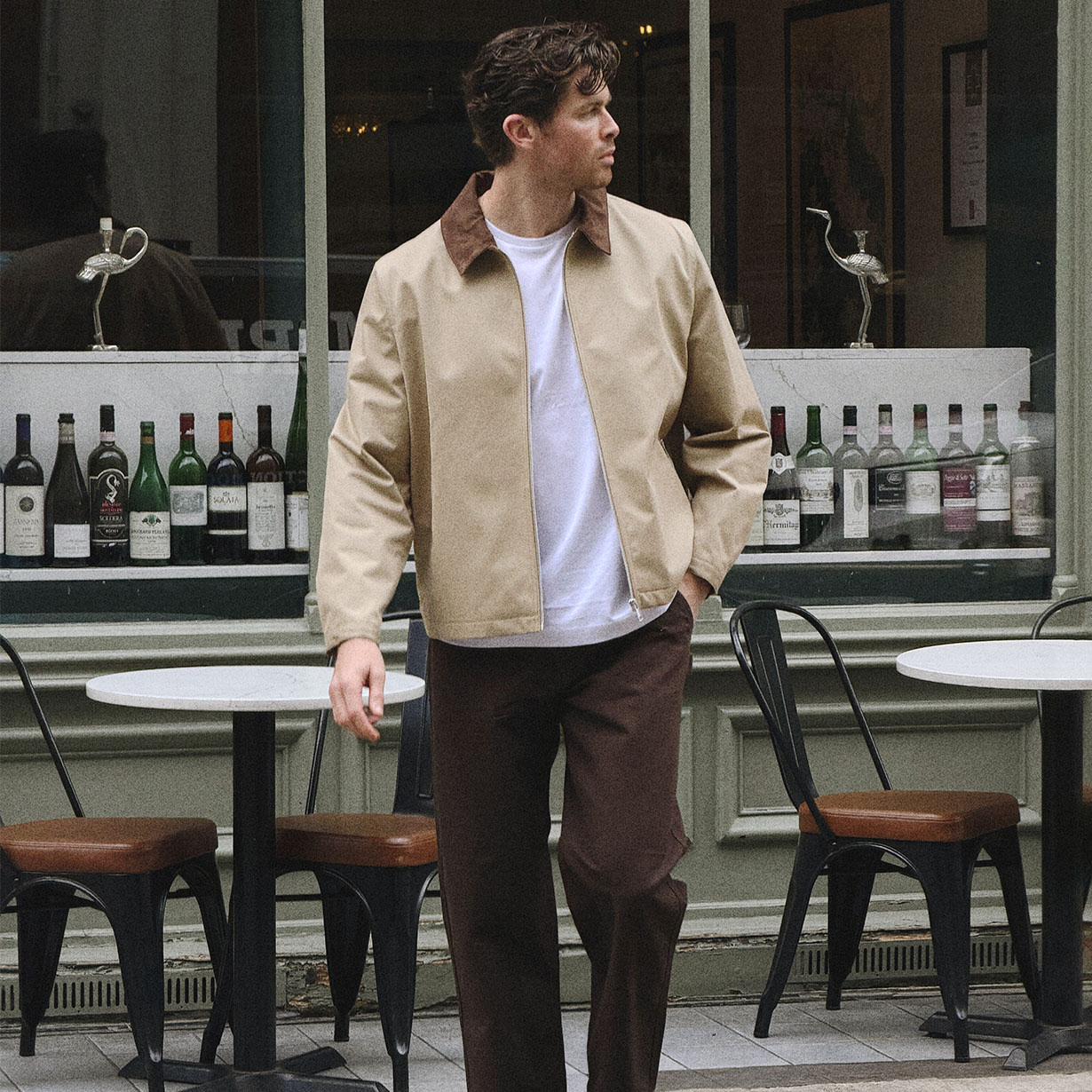 man wearing jacket and looking to the side