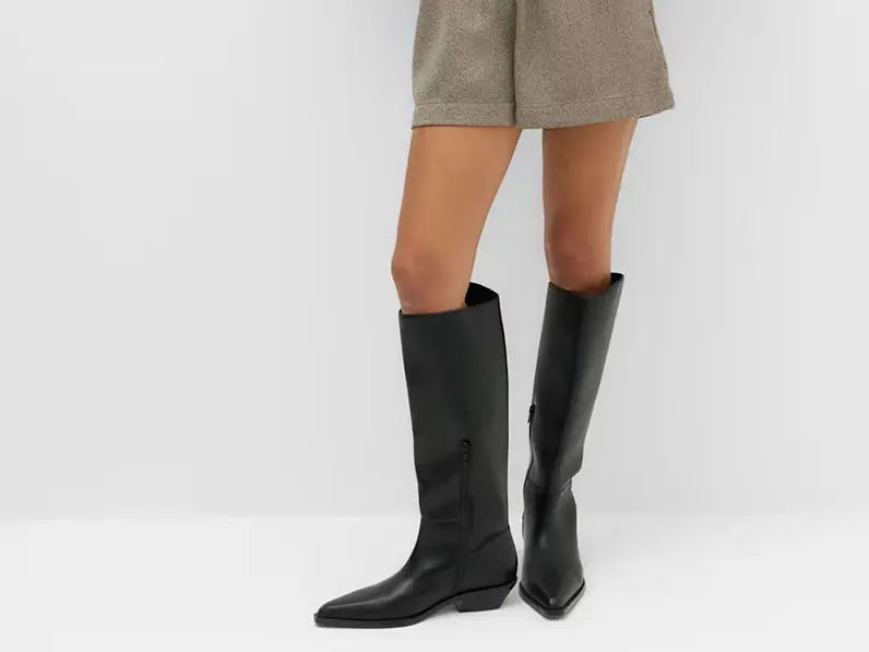 Woman in knee-high boots and shorts