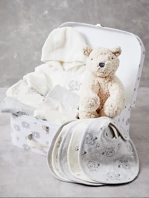 Baby starter gift box containing bibs and soft bear toy. Shop baby shower gifts