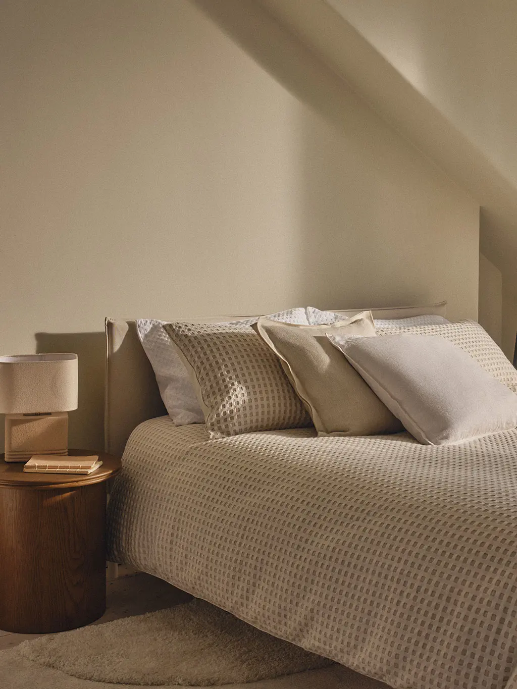 Bed in neutral bedroom