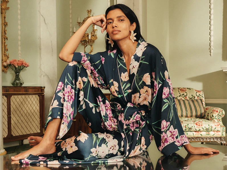Woman wearing M&S x Olivia von Halle floral dressing gown