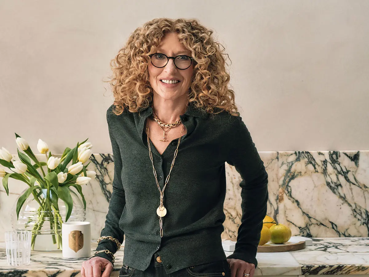 Kelly Hoppen wearing dark green cardigan 