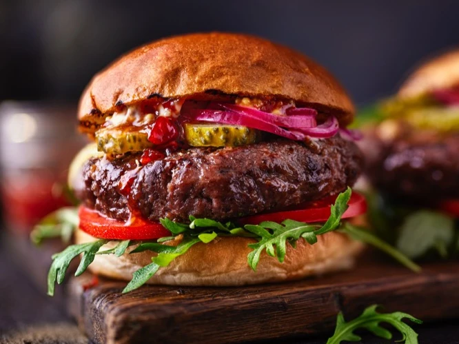 Burgers on wooden board