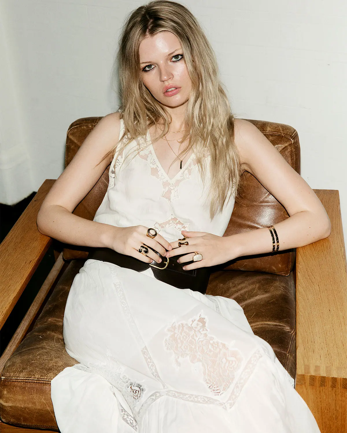 Woman wearing cream lace top and matching skirt