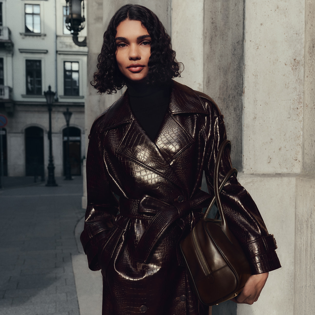 Women wearing croc print trench coat
