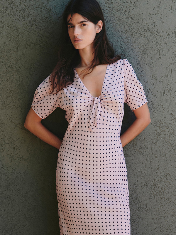 Woman in polka dot dress