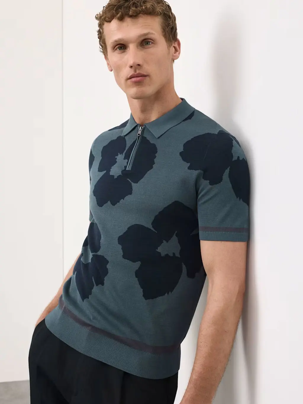 Man wearing floral-print polo shirt