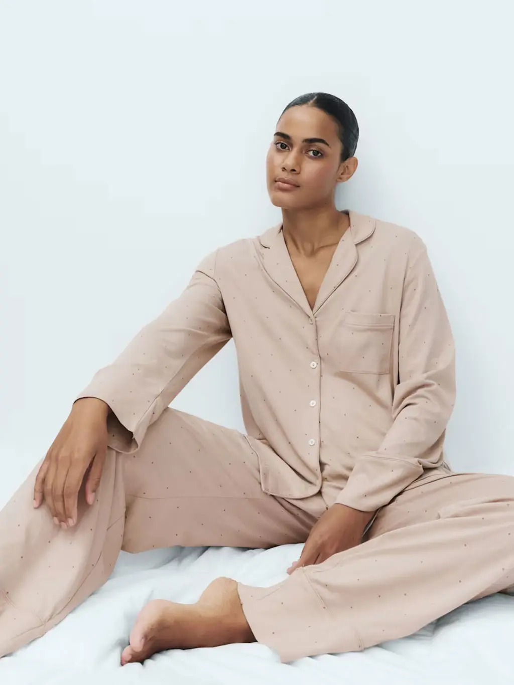 Woman in brown pyjamas