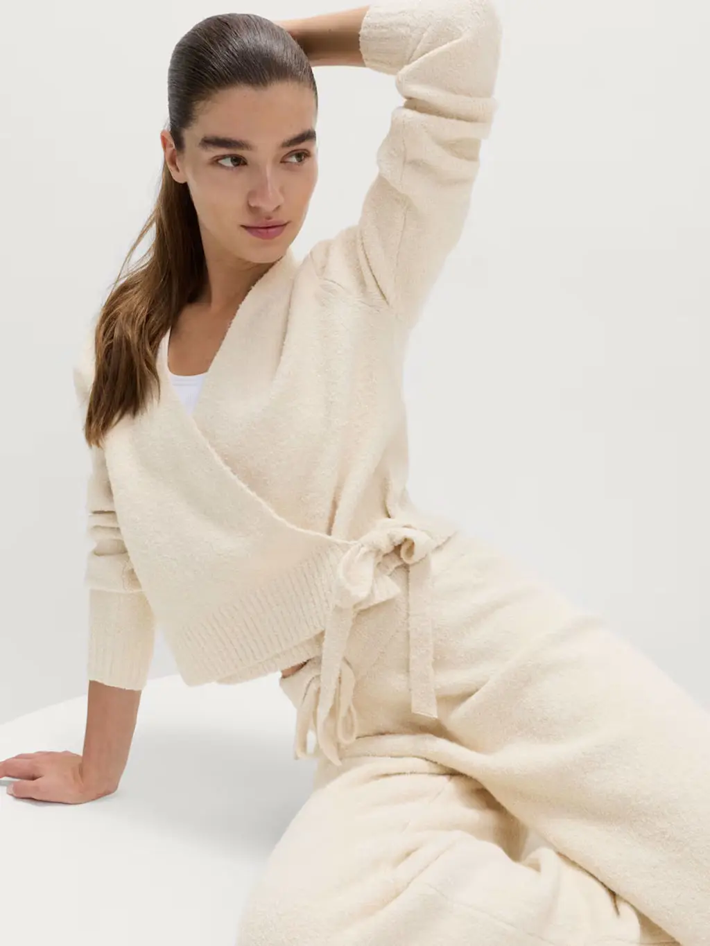 Woman wearing cream cardigan and joggers set