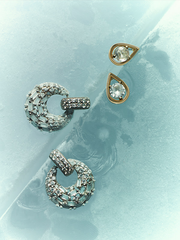 Earrings on blue background