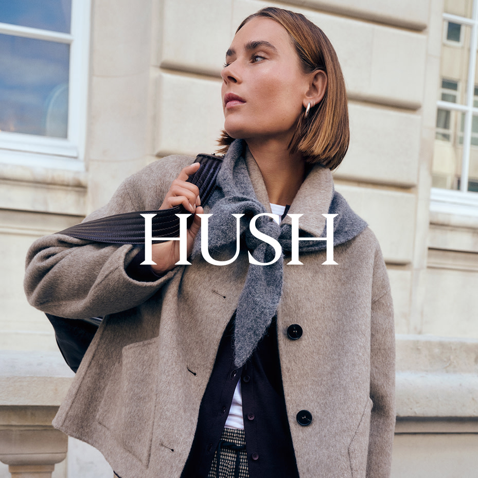 Woman wearing grey scarf, beige jacket and black cardigan by Hush