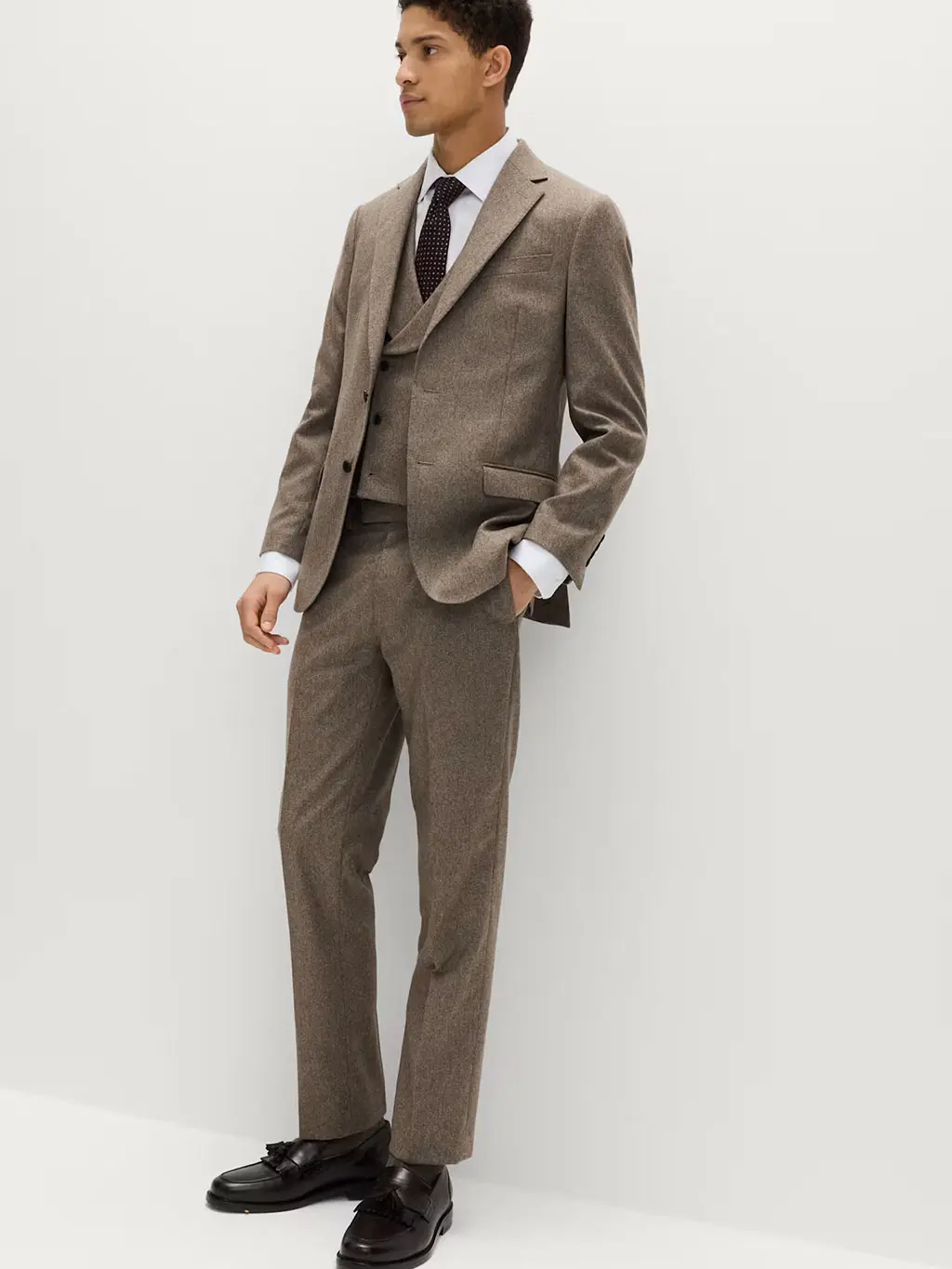 Man in brown tweed suit