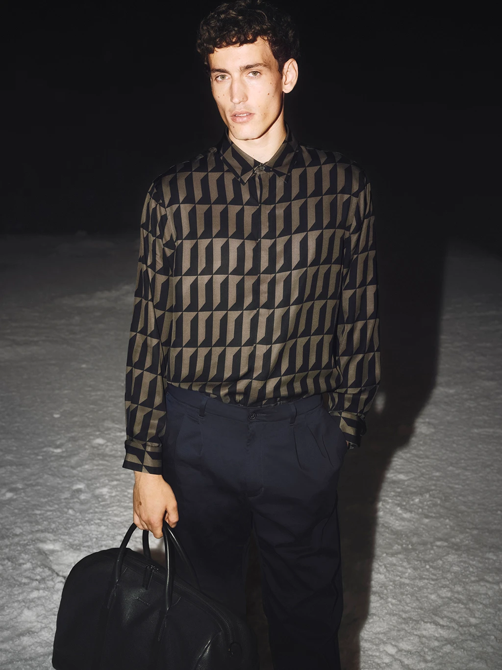 Man wearing geometric-print shirt