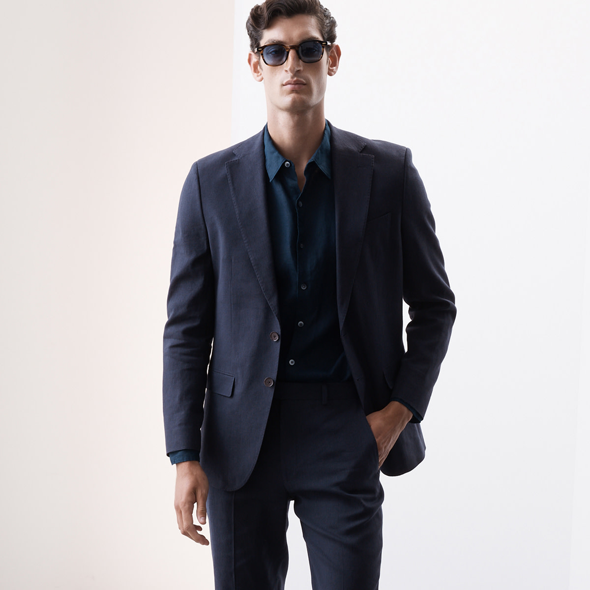 Man wearing a black coat suit. 