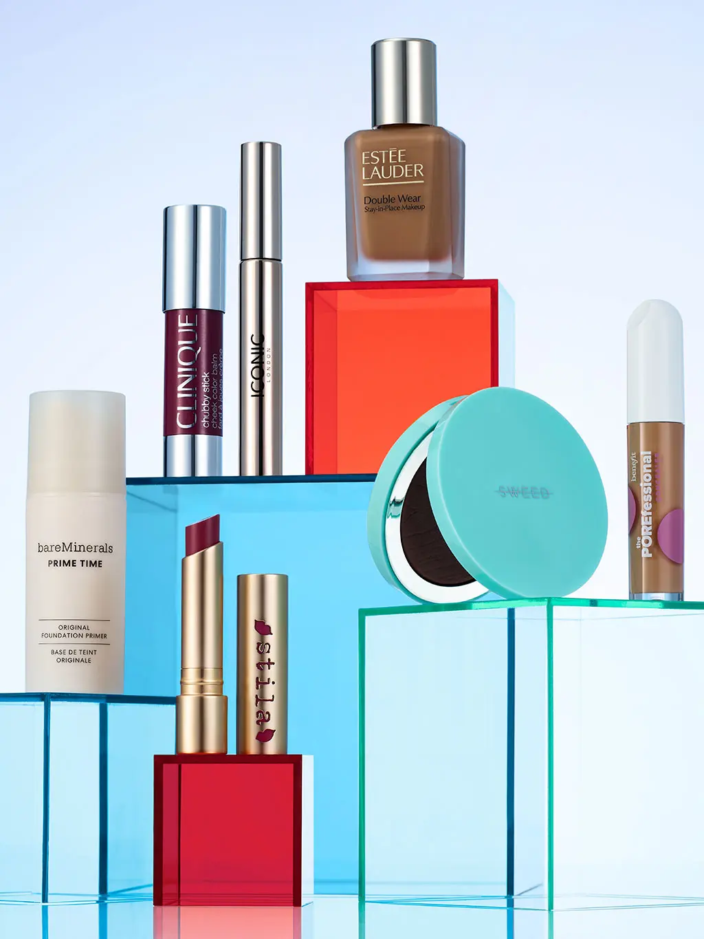 Makeup products on blue and orange blocks
