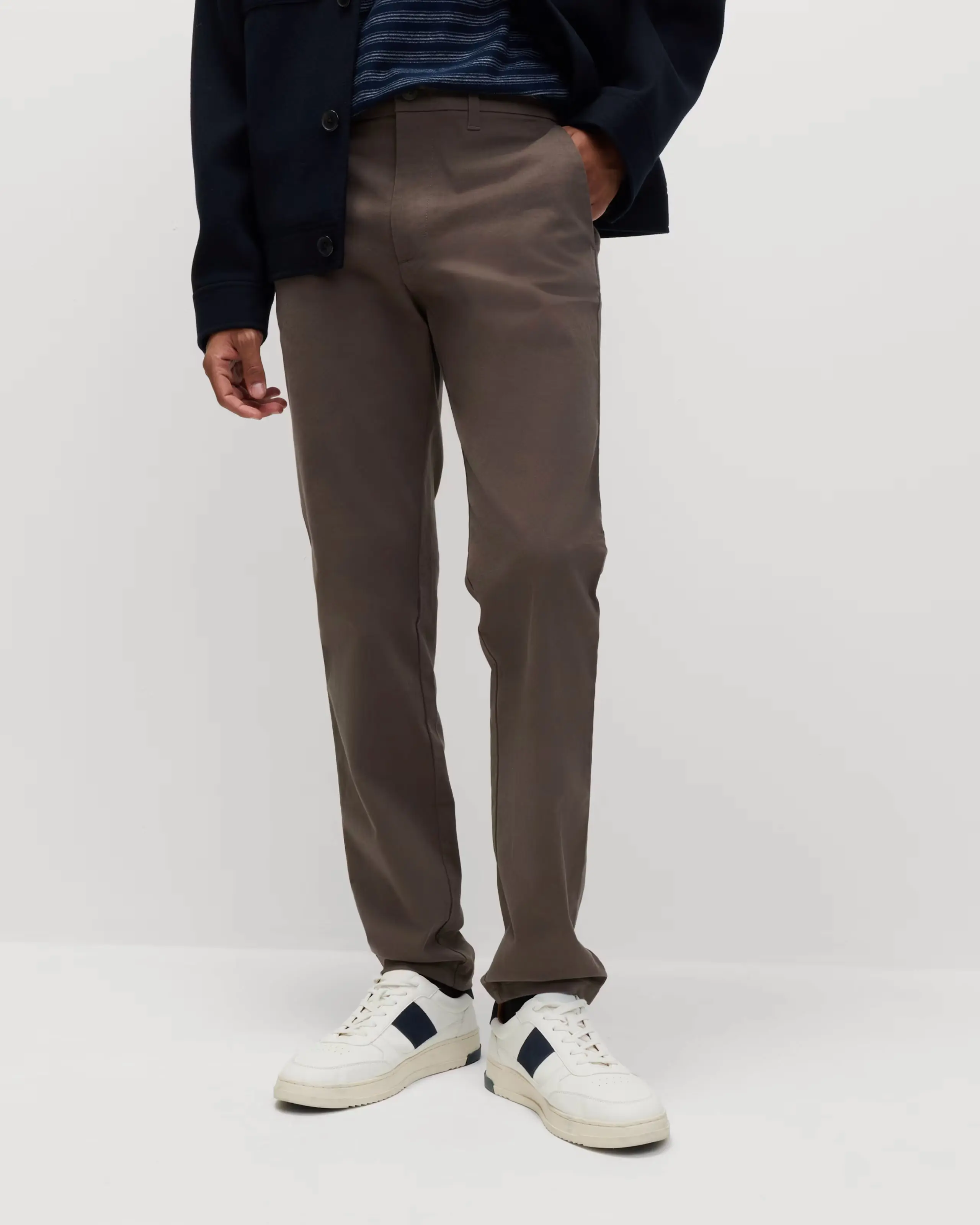 Man wearing khaki slim-fit chinos