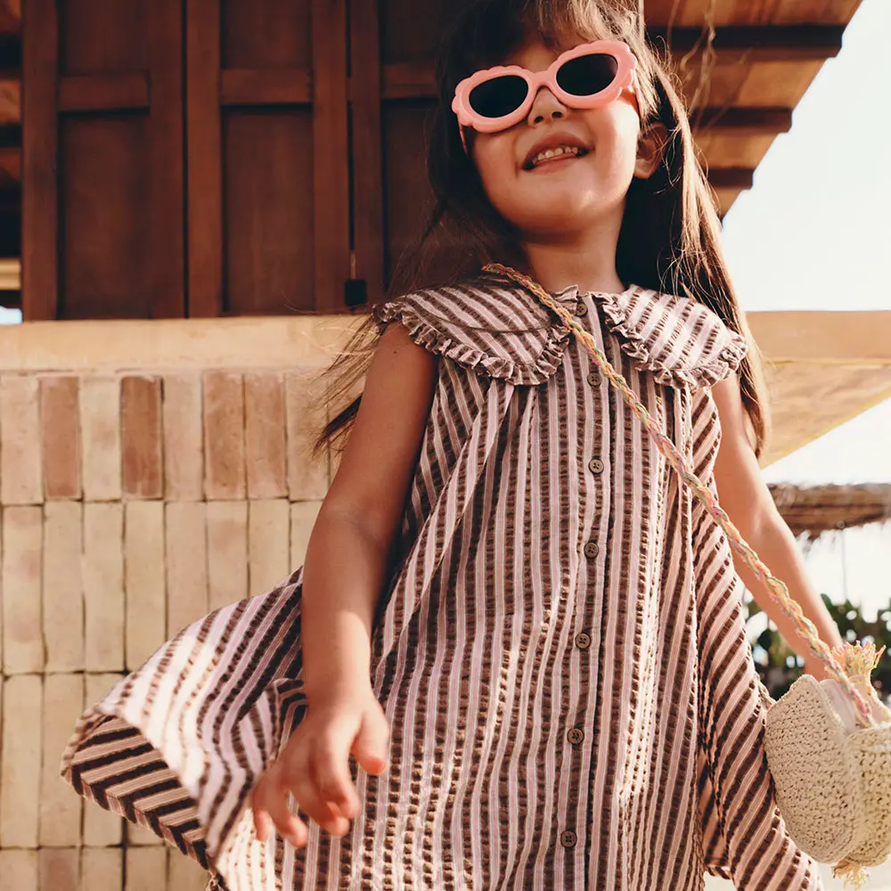 Girl in dress and sunglasses