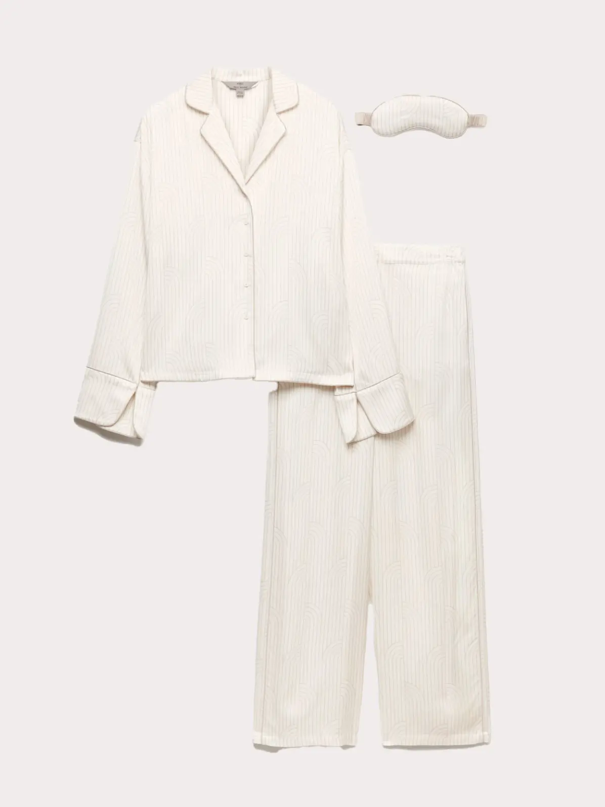 White pyjama set including top, trousers and eye mask