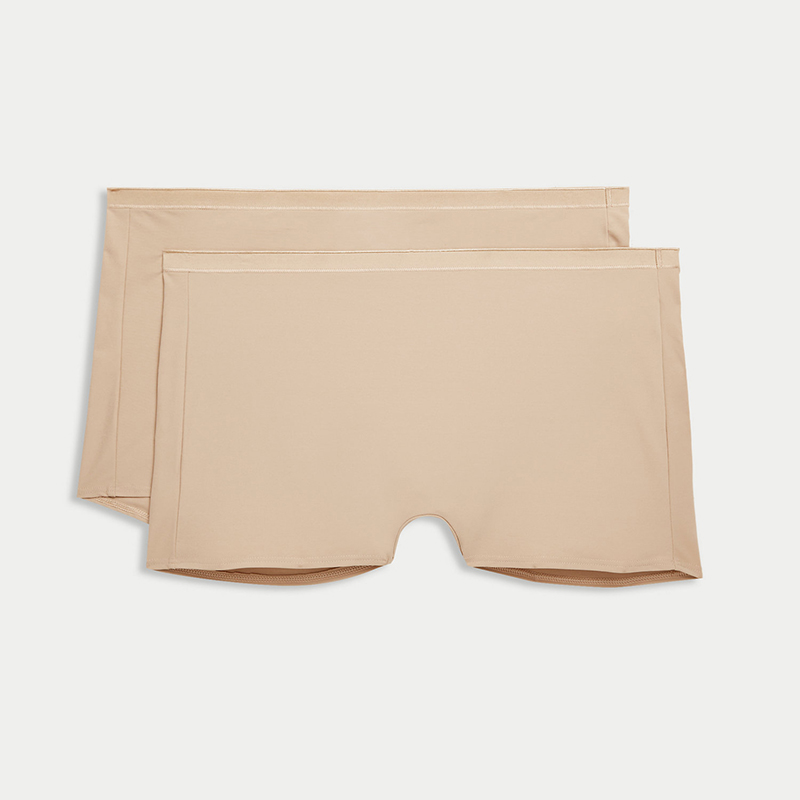 Two-pack of beige shapewear shorts. Shop now