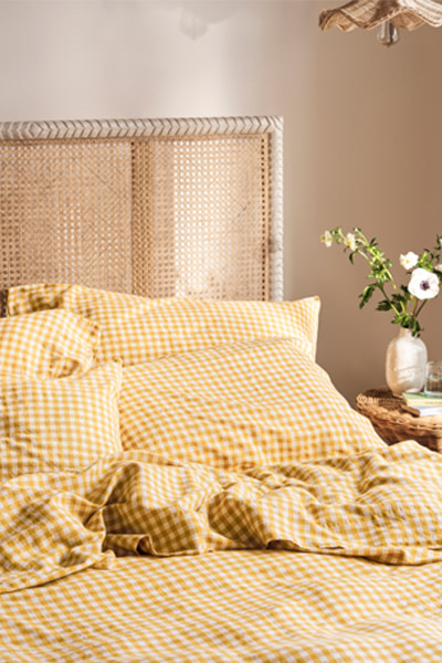close up of yellow gingham bedding