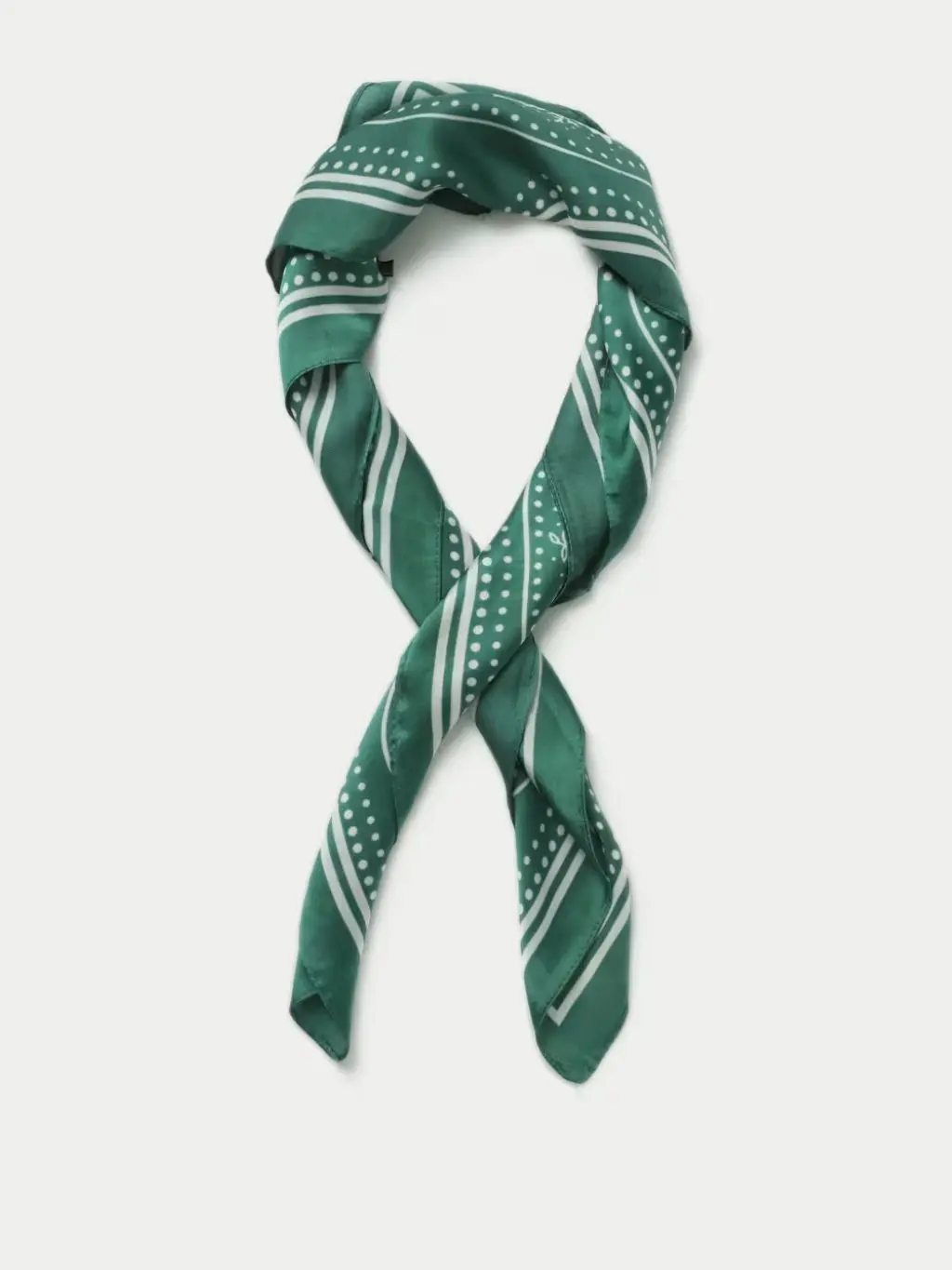 A cutout of a green and white satin scarf