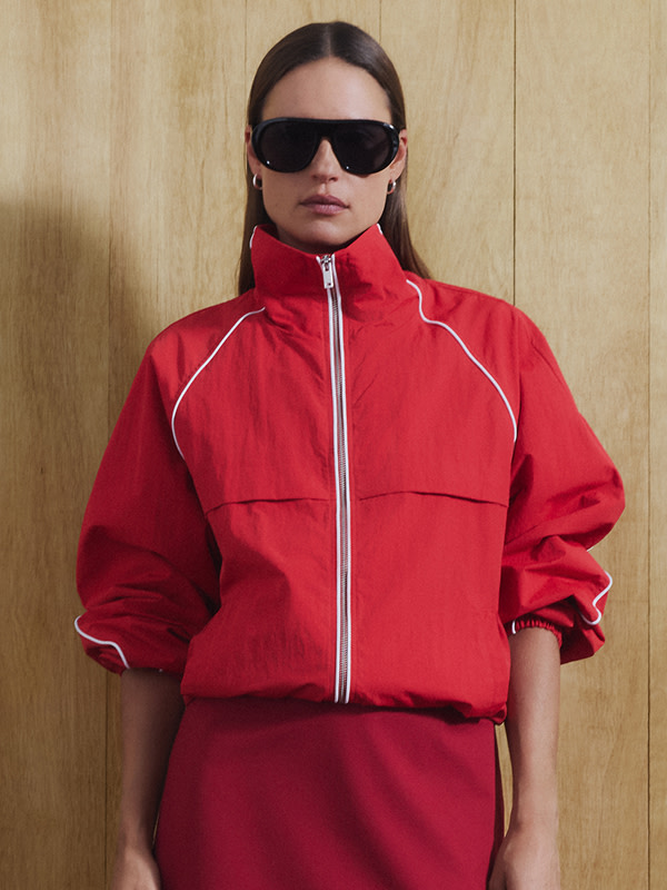 Woman in red tracksuit