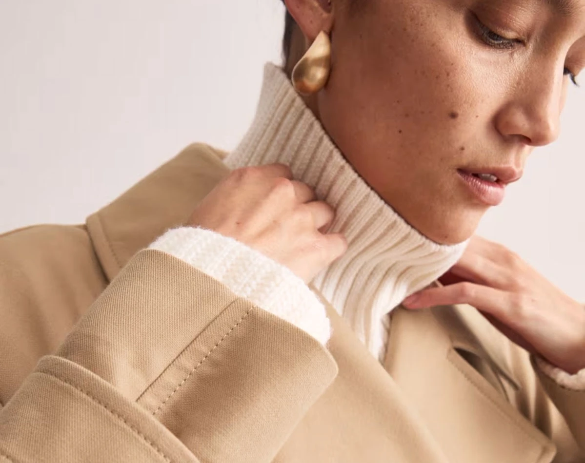 Woman wearing a trench coat at M&S