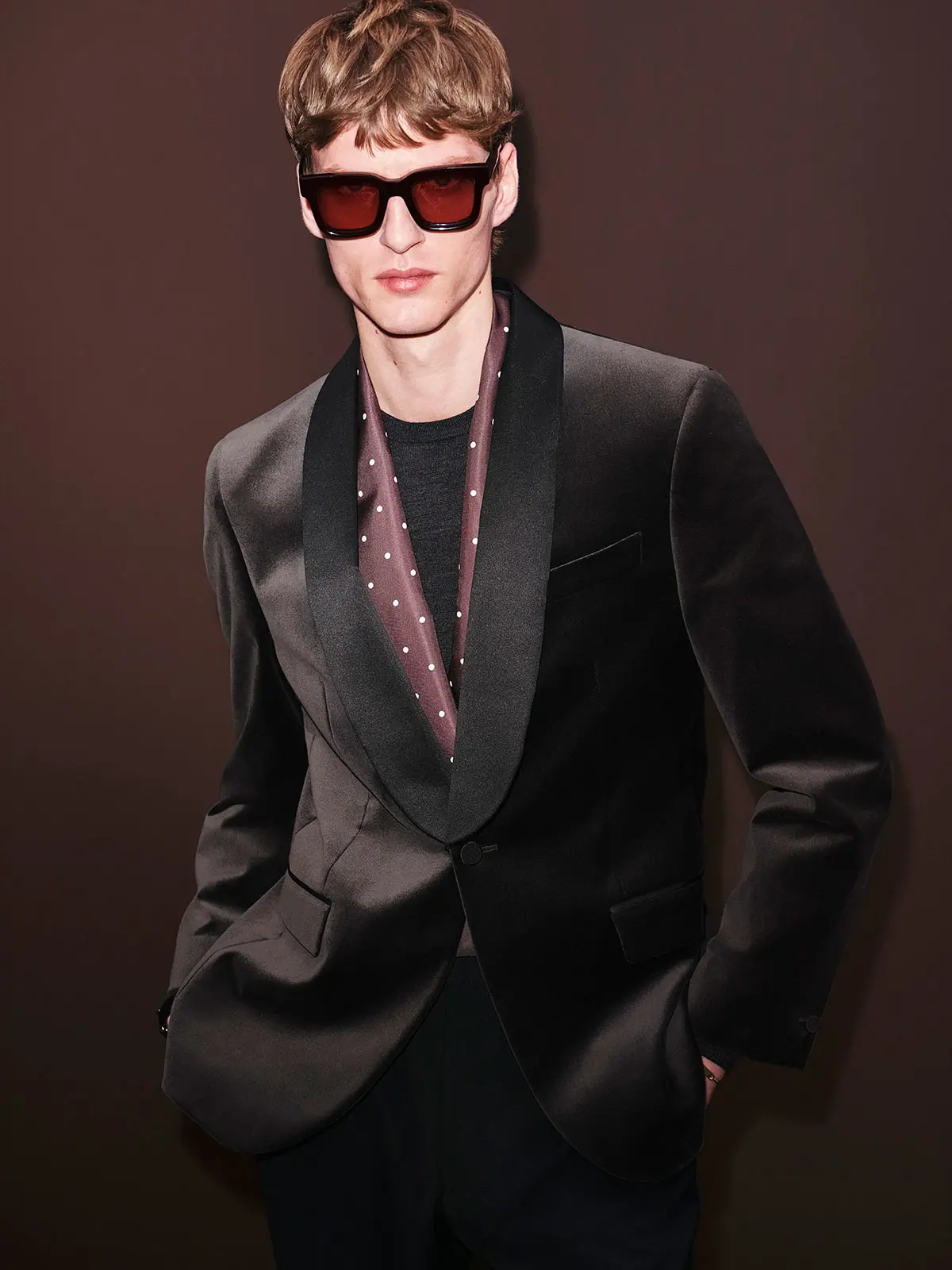 Man wearing black satin suit