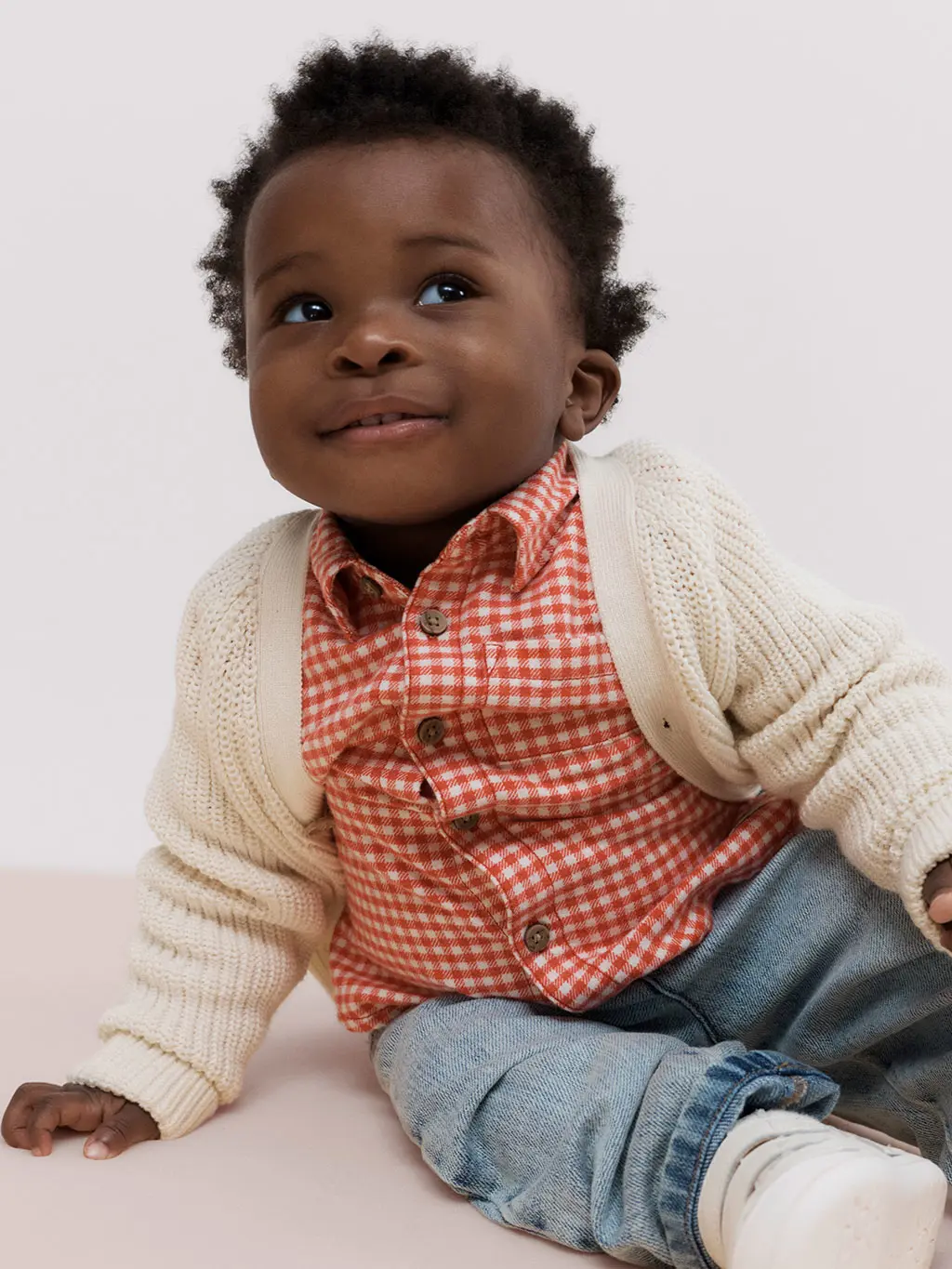 Little boy in front of white background