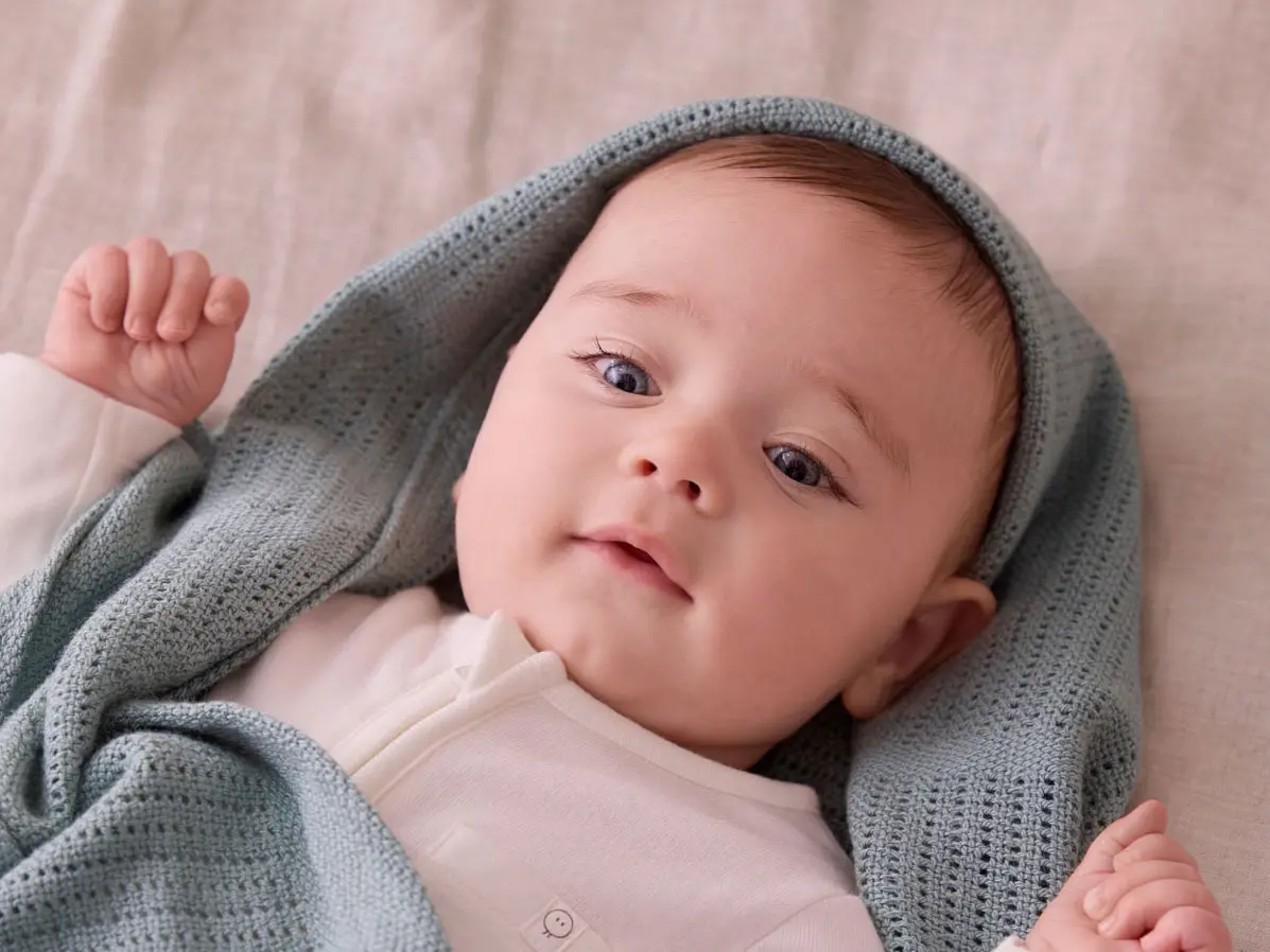Baby wearing a sleepsuit