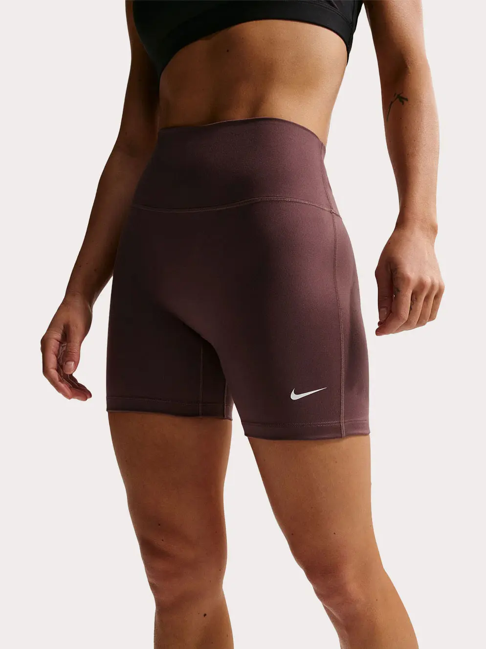 Woman wearing brown sports shorts
