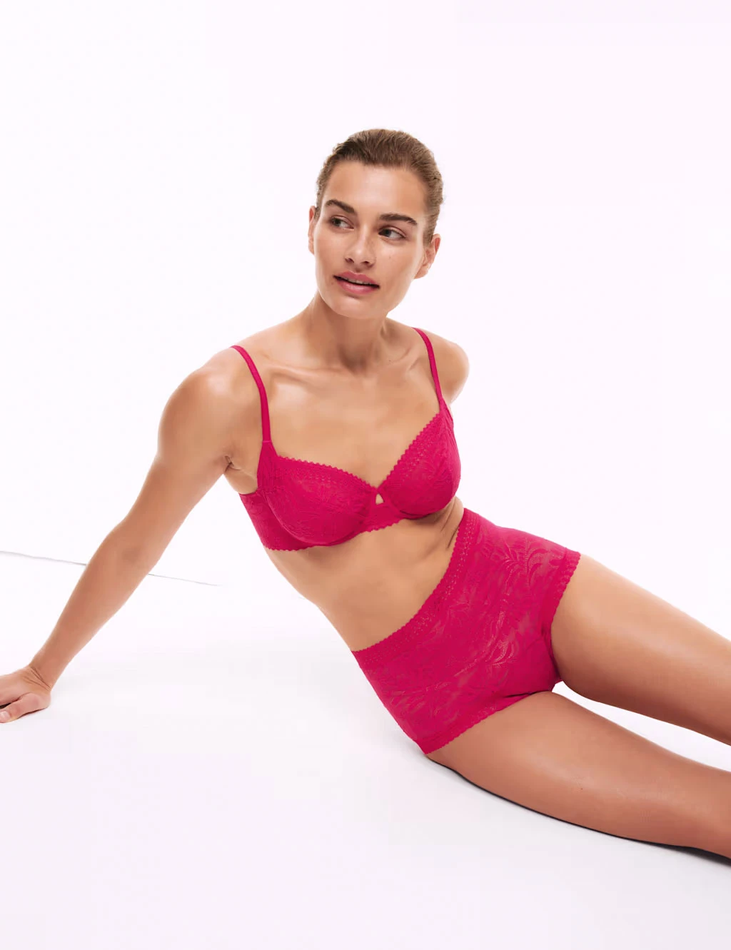 Woman wearing hot-pink lace bra and matching high-waisted period knickers
