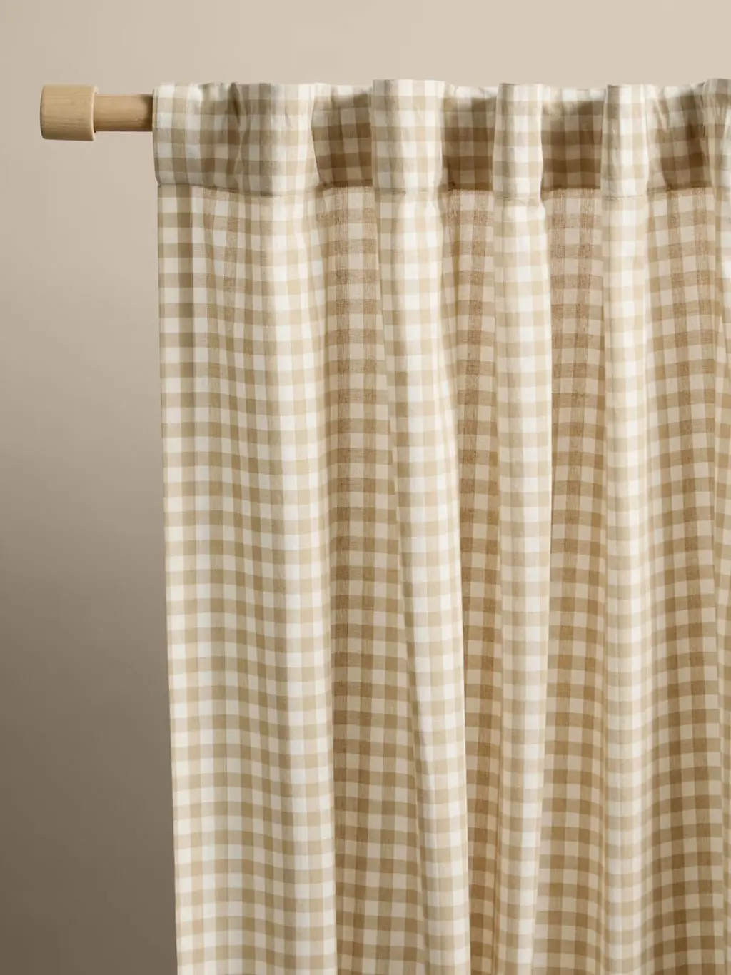 Close up of gingam curtains on rod