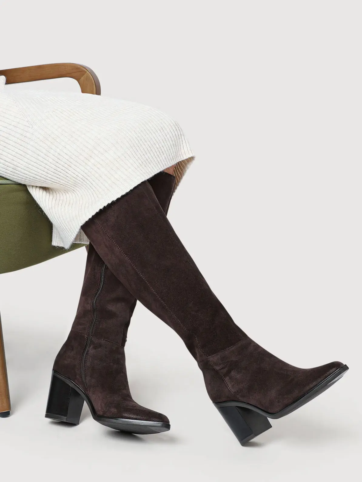 Close-up of brown suede heeled boots