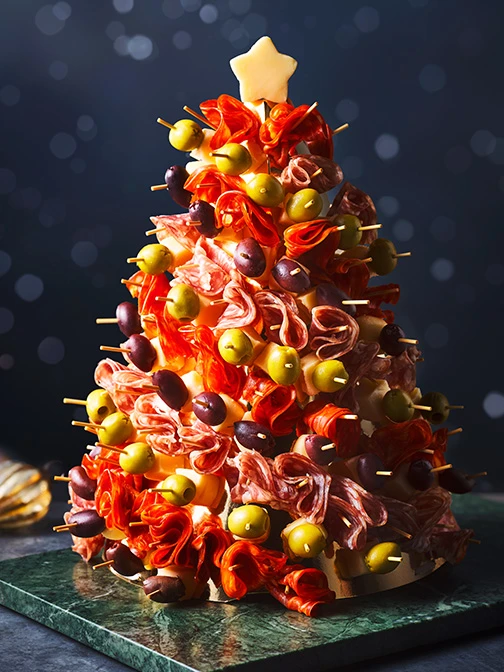 Charcuterie Christmas tree with olives, meat, and cheese