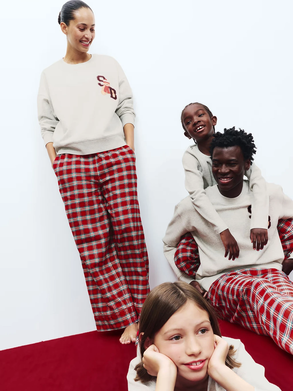Family wearing matching Christmas pyjamas