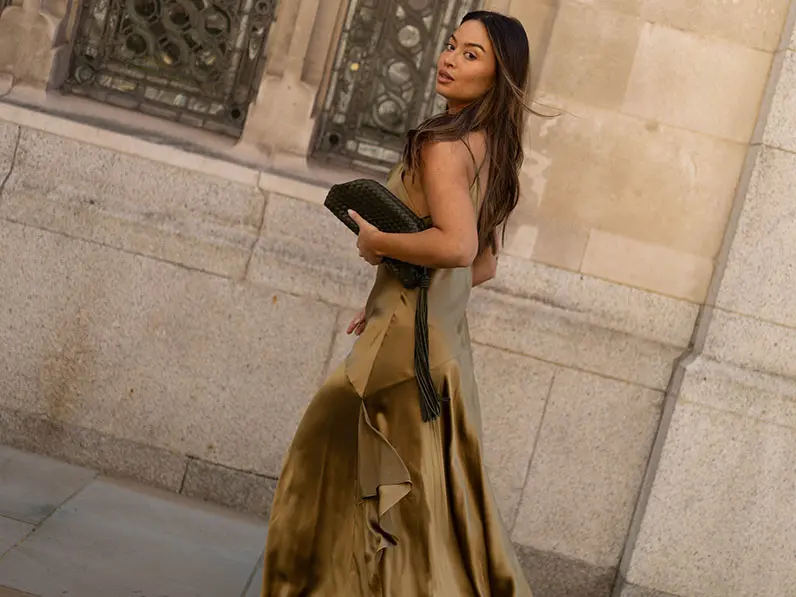Woman in olive green satin dress