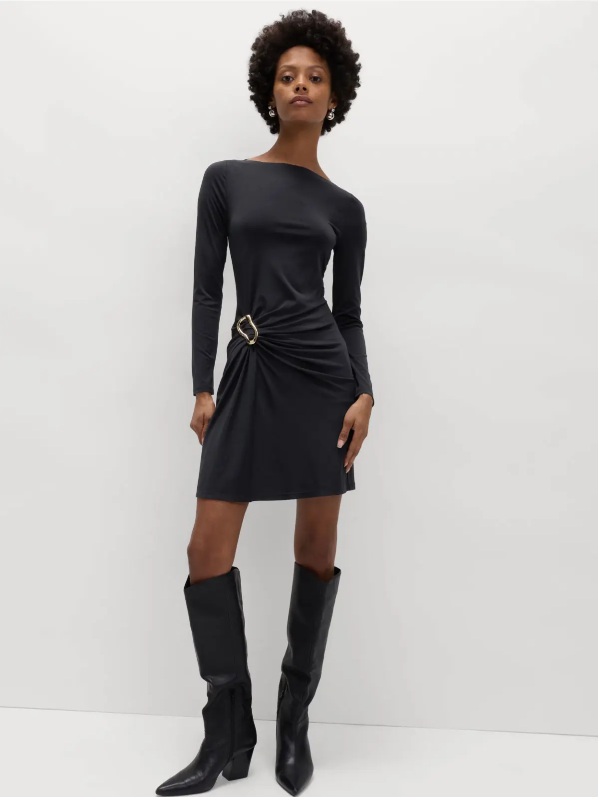 Woman wearing a knee-length black dress