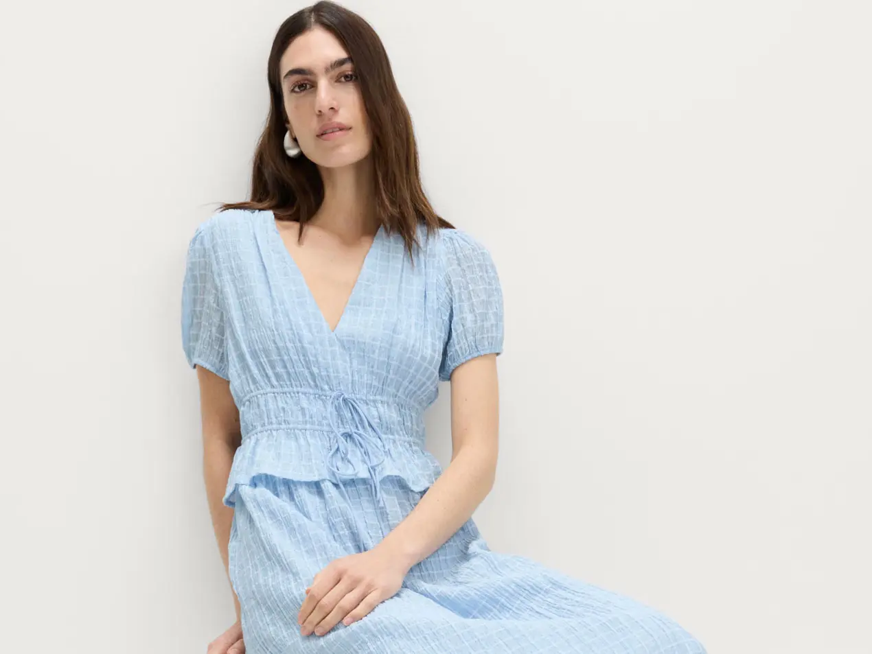 Woman wearing blue dress 